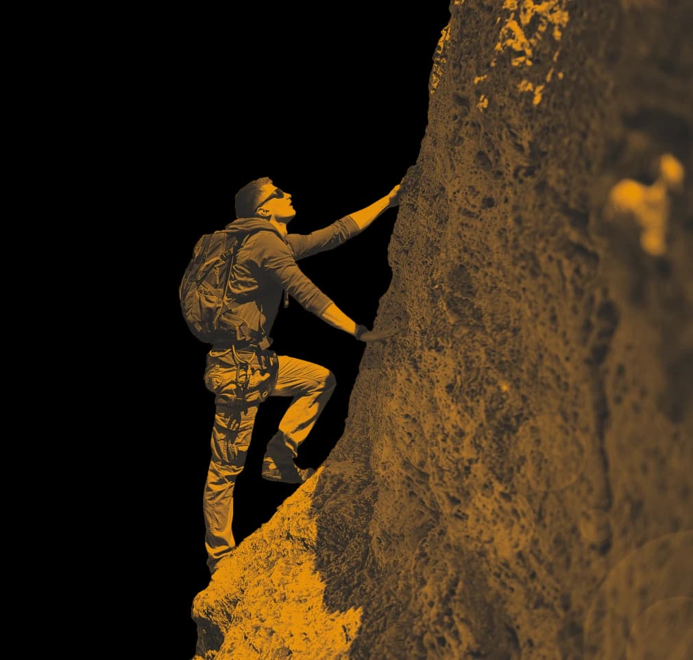 Man Climbing a Mountain